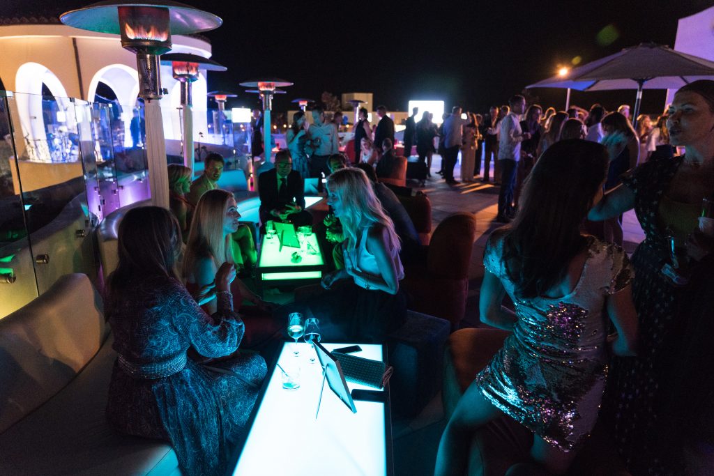 Sky garden - modern glow lounges and cocktail tables with guests