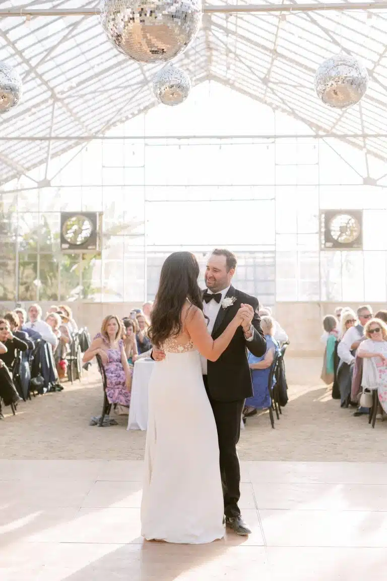 groom and bride dancing under the tent