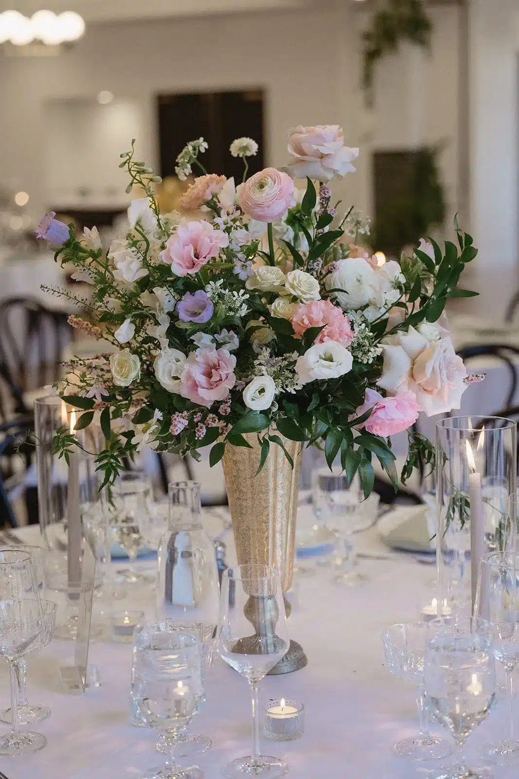table set with pink and white flowers