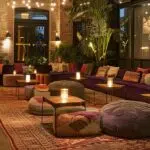 a stylishly arranged lounge area with plush, modern seating, ambient lighting, and elegant decor, designed for intimate gatherings and private events in a chic urban venue.