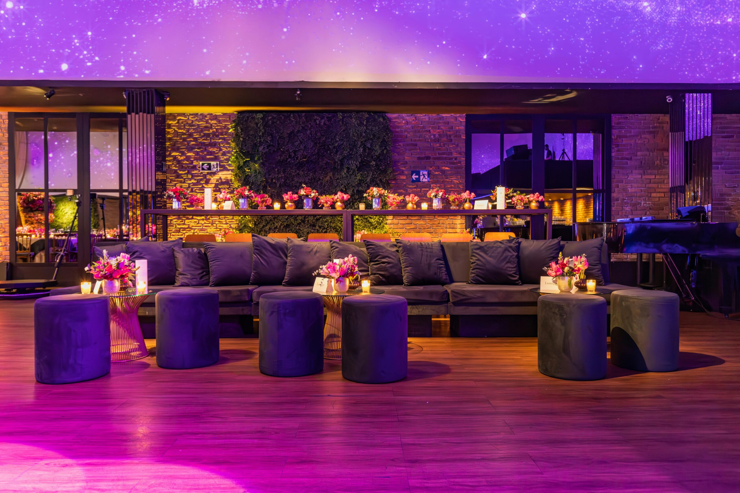 gray sofas in contrast with purple event theme