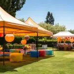 a vibrant outdoor event scene showcases neatly arranged pop-up canopies providing shade and comfort for guests, with colorful decorations and tables set for a stress-free gathering under a clear blue sky.
