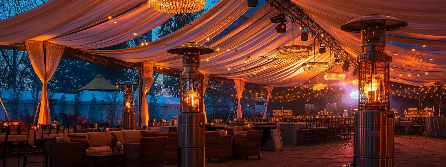 a warm, inviting tent setup for an outdoor event, featuring strategically placed industrial heaters under draped fabric, radiating a soft glow that appeals to guests during a chilly evening gathering.