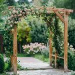 Rustic wooden wedding arch with flowers in a garden setting