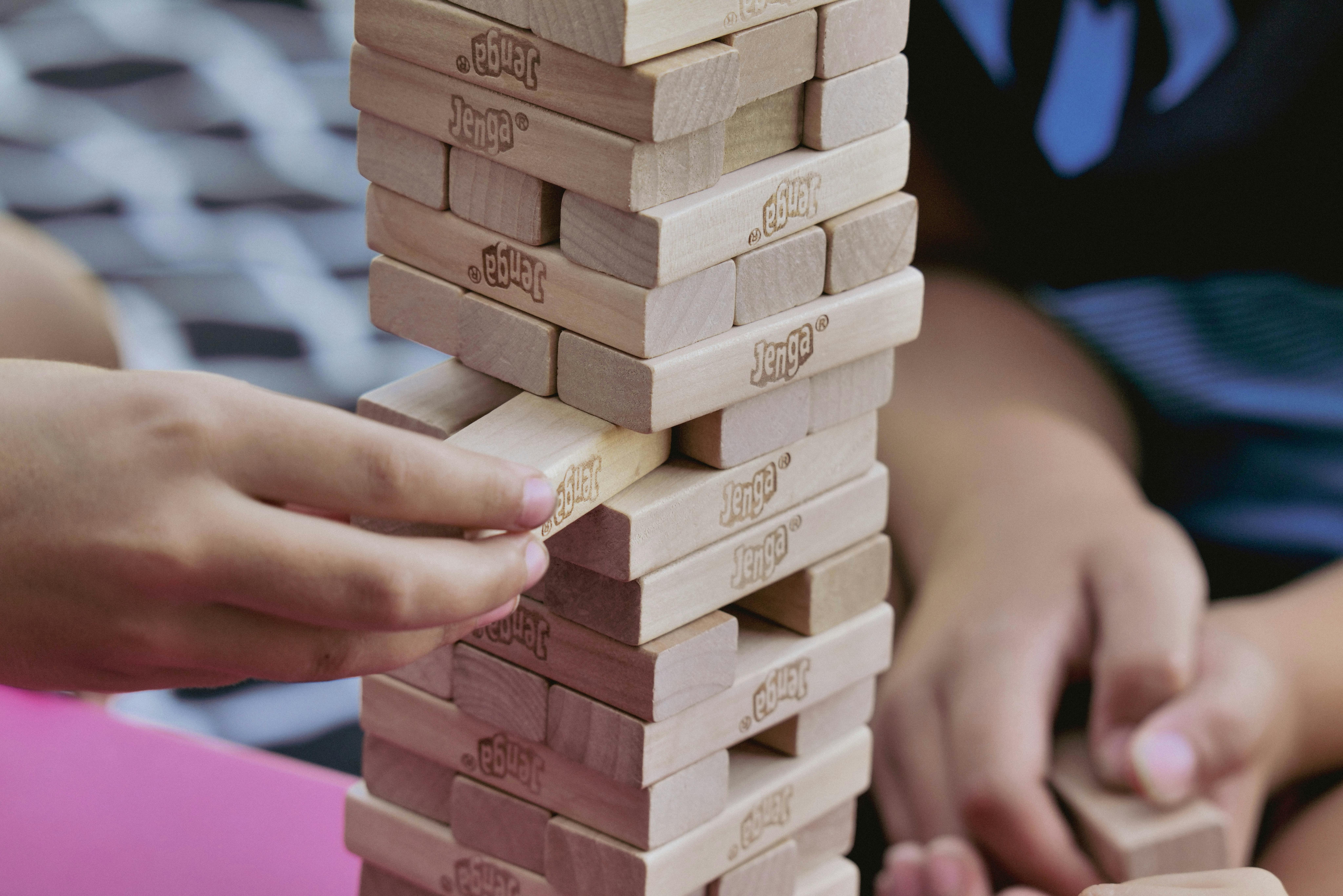 employees playing jenga at company retreat