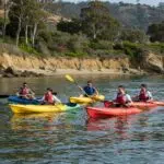 Outdoor corporate retreat setup in Ventura with tents and team-building activities