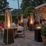 Outdoor gathering in Santa Barbara with guests enjoying patio heaters and cooling solutions