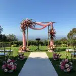 Stunning wedding arch and aisle runner setup for a Camarillo wedding ceremony