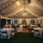 Cozy winter wedding tent setup with elegant decorations and warm lighting in Ventura