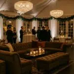 Elegant winter gathering with plush velvet sofas and warm lighting