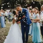 a couple kissing at a wedding