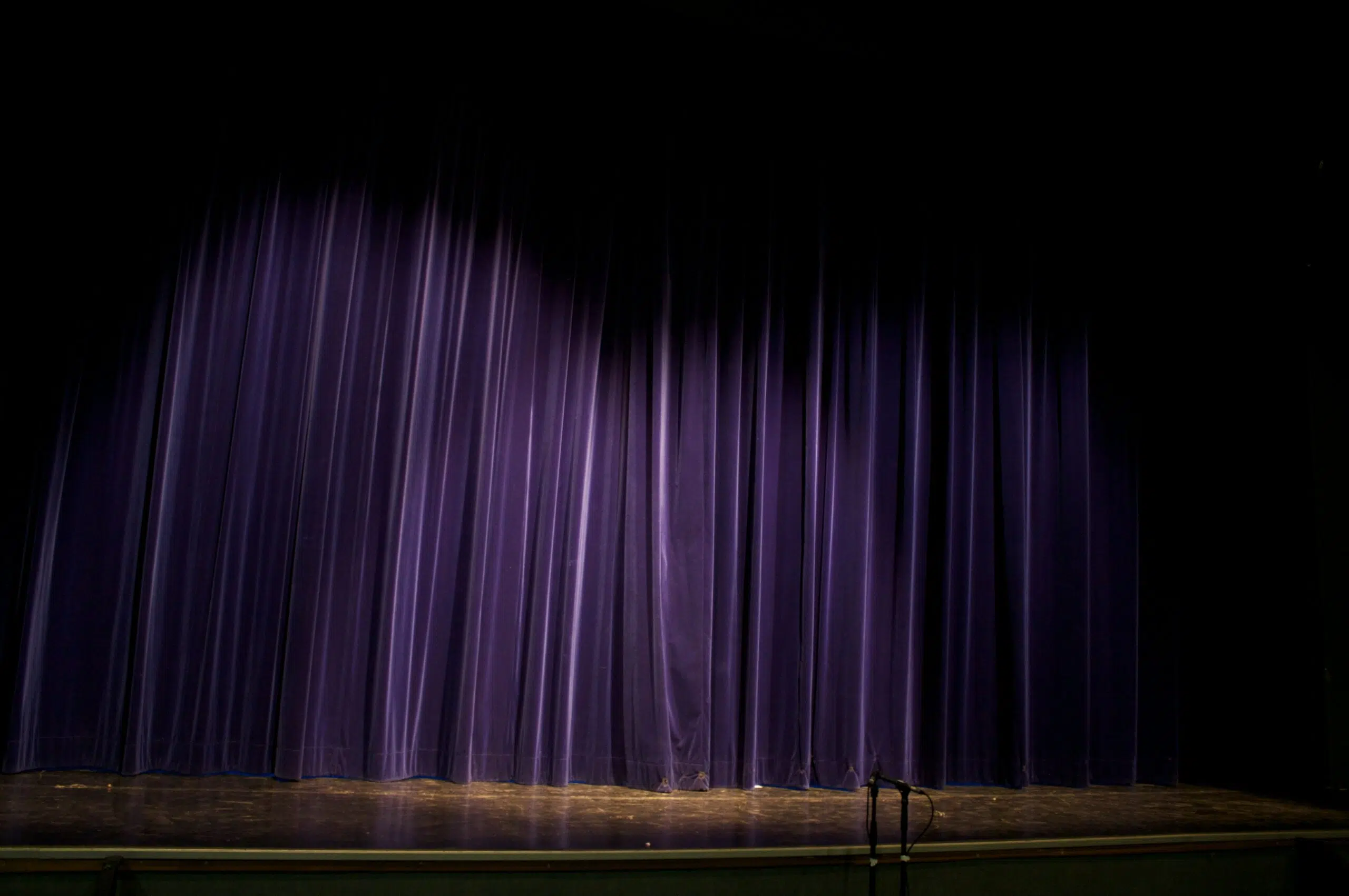 Stage setup with purple curtains, showcasing a performance area for events, relevant to stage rentals and planning logistics in Ventura County.