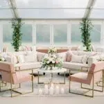 Elegant wedding lounge area with stylish sofas and ambient lighting