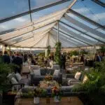 Outdoor corporate event tent setup in Ventura County with guests enjoying the atmosphere