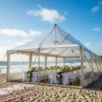 Wedding tent on a windy Malibu beach, showcasing wind-resistant design and coastal scenery