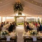 Backyard tent wedding setup in Ventura County with elegant decorations and outdoor ambiance