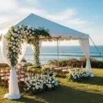 Coastal California wedding setup with tent and ocean view