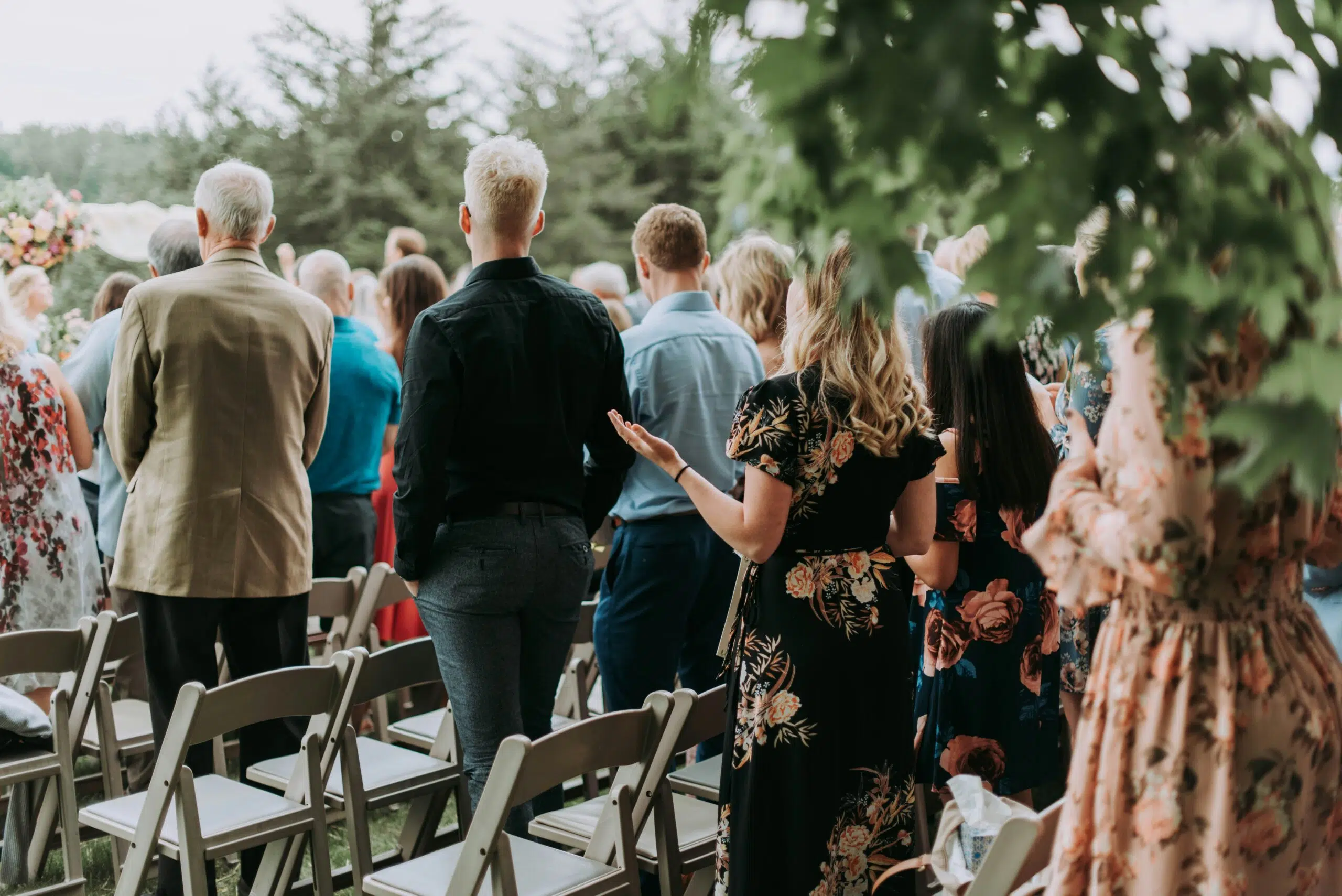 Guests gathered at a wedding ceremony with the couple at the front