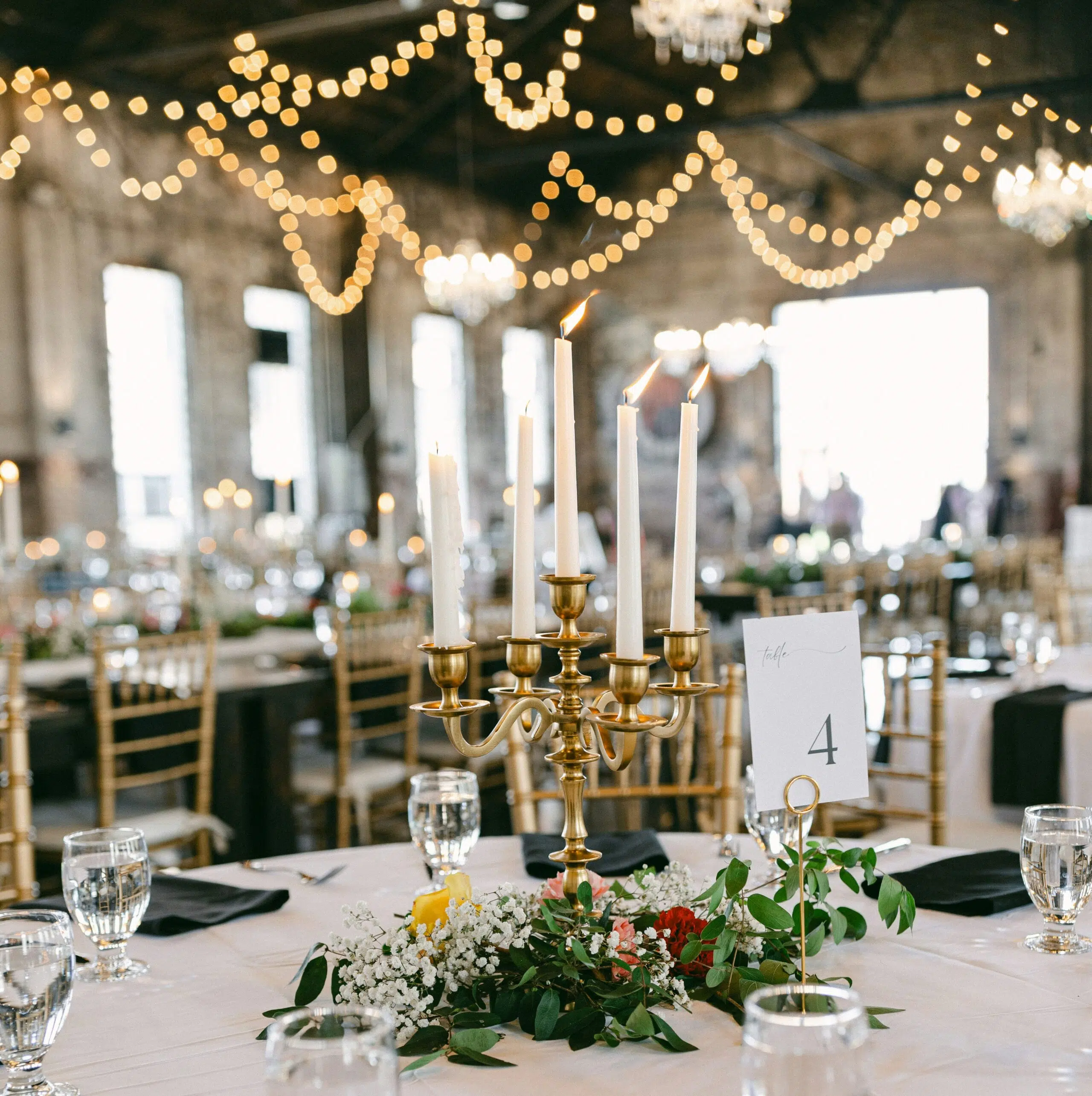 Coordinated wedding tables and chairs arranged for celebration