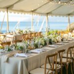 Beach Wedding tent, lighting, chairs, tables and linen in summer
