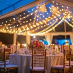 outdoor wedding tent setup, nighttime, lighting, tables and chairs, decor