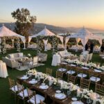 Outdoor wedding setup in Santa Barbara with elegant tents and stylish furniture