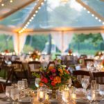 event with tent, lighting, chairs and tables, flowers, linens for summer