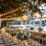 outdoor wedding with tent, lighting, chairs and tables, flowers for decor