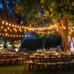 outdoor wedding venue, lighting, chairs and tables