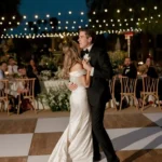 couple dancing under lights on a dancefloor