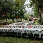 Long-table corporate dinner setup in Santa Barbara with spacious guest seating