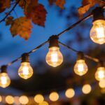 Close-up of LED festoon lights glowing in an outdoor fall setting, emphasizing energy efficiency and ambiance