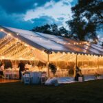 Outdoor wedding with tent, lighting, chairs and tables